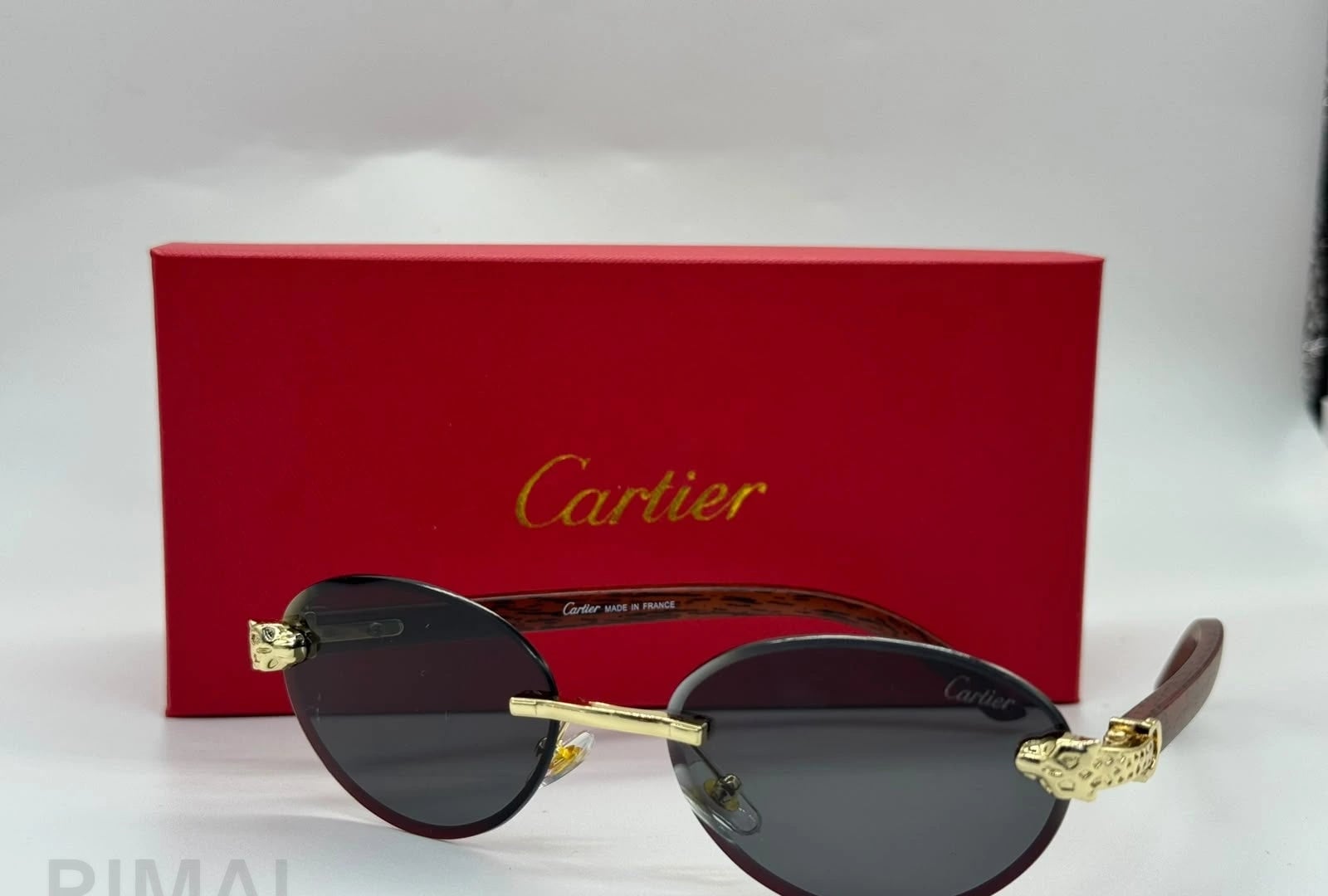 كارتييه | نظارة شمسية Panthère de Cartier بدون إطار – ذهبي / بني متدرج