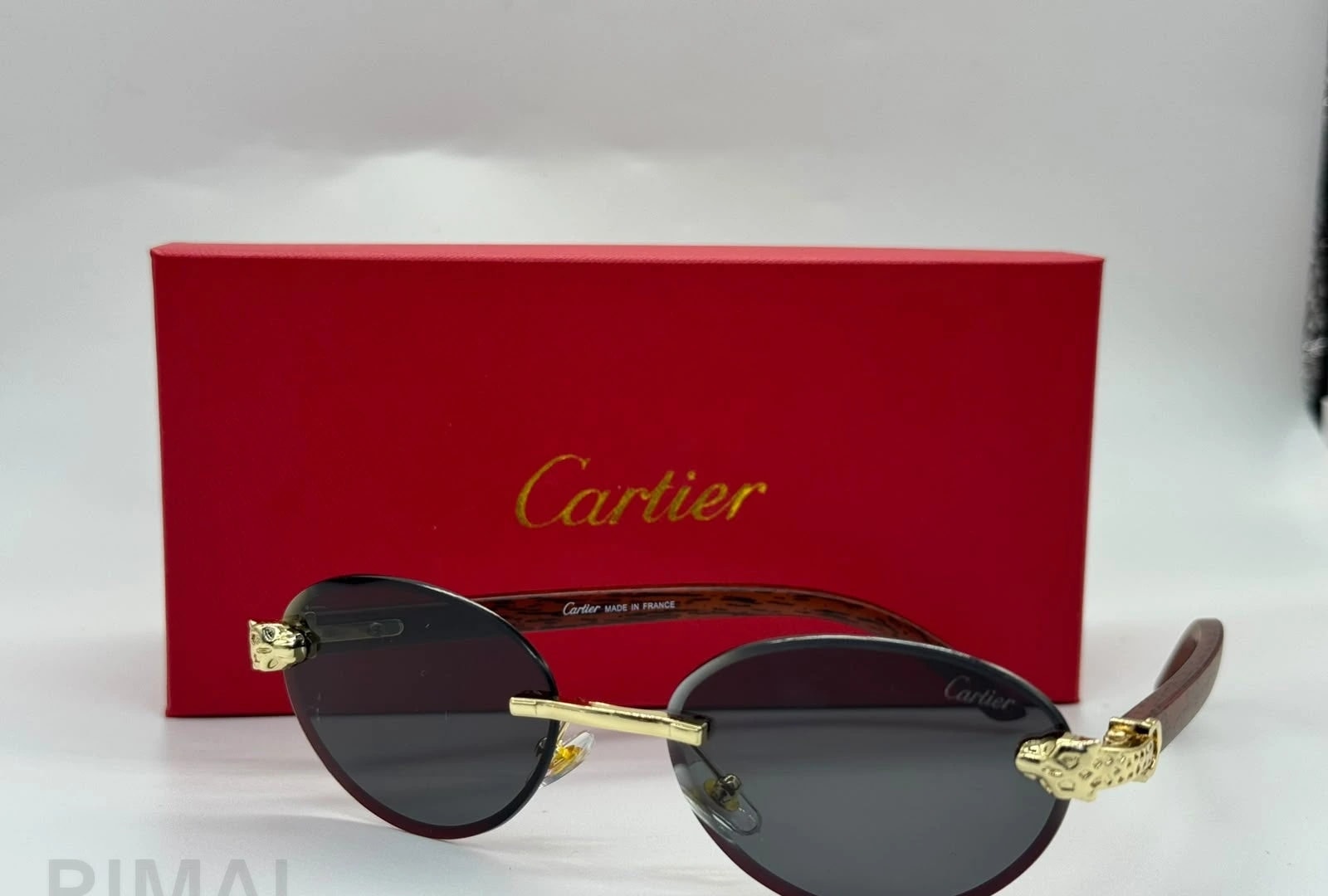 كارتييه | نظارة شمسية Panthère de Cartier بدون إطار – ذهبي / بني متدرج